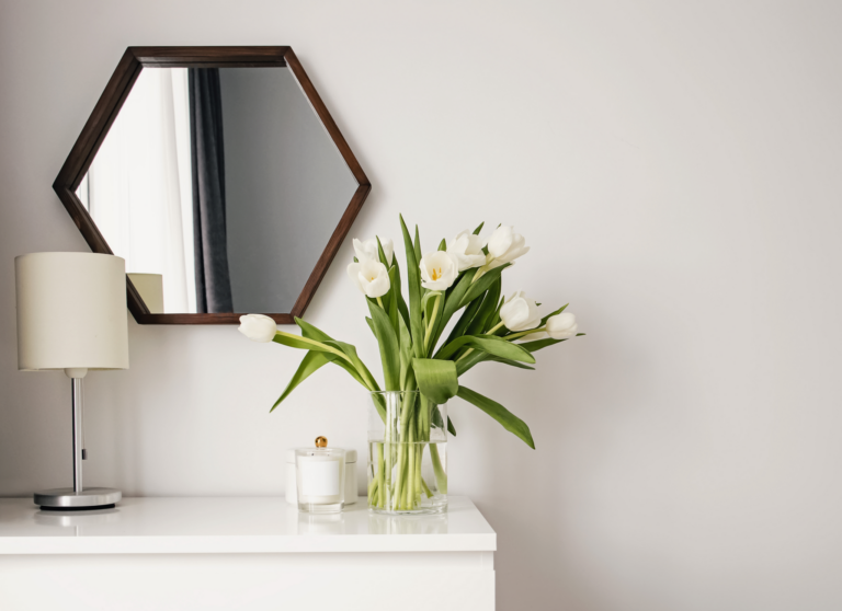 Photo of flowers sitting on a white dresser
